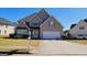 Charming two-story home with a well-manicured lawn and attached two-car garage, perfect for Gathering living at 7926 Palomino Pass, Riverdale, GA 30274