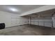 Spacious two-car garage featuring built-in shelving, providing ample storage and easy organization at 7926 Palomino Pass, Riverdale, GA 30274