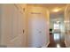 Hallway to living room featuring beautiful hardwood floors and natural light that enhances the inviting atmosphere at 7926 Palomino Pass, Riverdale, GA 30274