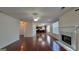 Inviting living room with fireplace and bright windows and hardwood floors that offer a modern, comfortable living space at 7926 Palomino Pass, Riverdale, GA 30274