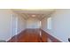 Bright living room with hardwood floors, tray ceilings, recessed lighting, and lots of natural light at 7926 Palomino Pass, Riverdale, GA 30274
