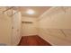 Large walk-in closet with shelving on every wall and overhead lighting at 7926 Palomino Pass, Riverdale, GA 30274