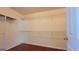 Spacious walk-in closet with ample shelving for organized storage at 7926 Palomino Pass, Riverdale, GA 30274