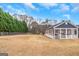 Fenced backyard features a covered patio, perfect for outdoor entertaining and leisure at 1500 Highway 155 North, Mcdonough, GA 30252