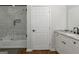 Bathroom with tub and shower combo, white cabinets, granite countertop and tiled shower at 1500 Highway 155 North, Mcdonough, GA 30252