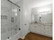 Bathroom featuring tub and shower combo, double vanity with granite countertop and tiled shower at 1500 Highway 155 North, Mcdonough, GA 30252