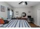 Bright bedroom with ceiling fan, window, and views of the outside at 1500 Highway 155 North, Mcdonough, GA 30252
