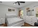 Bright bedroom with ceiling fan, and neutral colored decor and window at 1500 Highway 155 North, Mcdonough, GA 30252