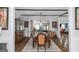 Spacious dining room featuring a large table set for a meal, complemented by a china cabinet at 1500 Highway 155 North, Mcdonough, GA 30252