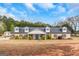 Charming one-story home with a welcoming front porch, manicured lawn, and dormer windows at 1500 Highway 155 North, Mcdonough, GA 30252