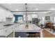 Bright kitchen features white cabinets, granite countertops, stainless steel appliances, and center island with seating at 1500 Highway 155 North, Mcdonough, GA 30252