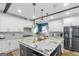 Modern kitchen featuring a large island, granite countertops, and stainless steel appliances at 1500 Highway 155 North, Mcdonough, GA 30252