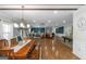 Open-concept living and dining area with hardwood floors, recessed lighting, lots of windows and is perfect for entertaining at 1500 Highway 155 North, Mcdonough, GA 30252