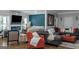 Modern living room with a gray sectional sofa, stylish decor, and an electric fireplace at 1500 Highway 155 North, Mcdonough, GA 30252