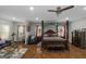 Luxurious main bedroom suite features sitting area, canopy bed, hardwood floors, recessed lighting, and lots of natural light at 1500 Highway 155 North, Mcdonough, GA 30252