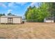 Spacious backyard with two outbuildings, offering ample storage and possibilities at 1500 Highway 155 North, Mcdonough, GA 30252