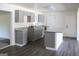 Modern kitchen featuring sleek cabinets, granite countertops, and an island for food preparation at 3647 Glen Mora Dr, Decatur, GA 30032