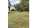 Spacious backyard featuring a trampoline and a well-maintained lawn at 7193 Cavender Sw Dr, South Fulton, GA 30331