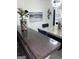 Dining area featuring granite countertops, modern light fixtures, and stylish decor at 7193 Cavender Sw Dr, South Fulton, GA 30331