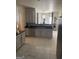 Modern kitchen with white cabinets, stainless steel appliances, and granite countertops at 7193 Cavender Sw Dr, South Fulton, GA 30331