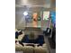 Comfortable living room that opens to the kitchen with cozy seating and a stylish blue rug at 7193 Cavender Sw Dr, South Fulton, GA 30331