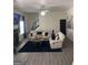 Cozy living room with modern furnishings, a fireplace, and stylish decor with accent walls at 7193 Cavender Sw Dr, South Fulton, GA 30331