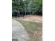 Neighborhood playground featuring swings and a park bench surrounded by mature trees at 7193 Cavender Sw Dr, South Fulton, GA 30331