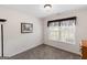 Bedroom with plush carpeting, natural light, and minimalist decor at 628 Morningside Dr, Stockbridge, GA 30281