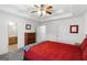 Bedroom with a ceiling fan, view to attached bathroom, and natural light at 628 Morningside Dr, Stockbridge, GA 30281