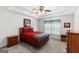 Comfortable bedroom featuring natural light, a ceiling fan, and neutral carpeting at 628 Morningside Dr, Stockbridge, GA 30281