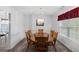Traditional dining room featuring a wooden table, seating for six, and elegant lighting at 628 Morningside Dr, Stockbridge, GA 30281