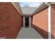 A welcoming red-brick entryway leads to the front door at 628 Morningside Dr, Stockbridge, GA 30281