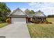 Charming brick home with a well-manicured lawn, two-car garage, and inviting curb appeal at 628 Morningside Dr, Stockbridge, GA 30281