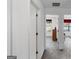 Hallway with neutral walls and carpeting connecting living spaces at 628 Morningside Dr, Stockbridge, GA 30281