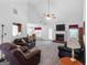 Spacious living room featuring a brick fireplace, vaulted ceiling, and plush seating at 628 Morningside Dr, Stockbridge, GA 30281