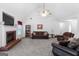 Spacious living room features a cozy fireplace, plush seating, and high vaulted ceilings at 628 Morningside Dr, Stockbridge, GA 30281