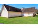 Spacious backyard features a well-maintained lawn and traditional siding at 136 Leguin Forest Dr, Locust Grove, GA 30248