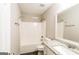 Bright bathroom features a shower over tub, granite countertop, and modern fixtures at 136 Leguin Forest Dr, Locust Grove, GA 30248