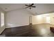 Open-concept living space with vaulted ceiling, seamlessly connecting living and dining areas at 136 Leguin Forest Dr, Locust Grove, GA 30248