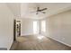 Cozy main bedroom with tray ceiling and bright natural light at 136 Leguin Forest Dr, Locust Grove, GA 30248