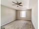 Spacious main bedroom with tray ceiling and neutral carpet at 136 Leguin Forest Dr, Locust Grove, GA 30248
