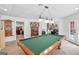 Finished basement game room featuring a pool table, dart board, and neutral colored carpet at 643 Old Greenville Rd, Fayetteville, GA 30215