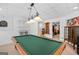 Finished basement with a pool table, dart board, shelving, and stylish decor at 643 Old Greenville Rd, Fayetteville, GA 30215
