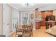 Cozy dining area with natural light, a wooden table set, and views to the kitchen at 643 Old Greenville Rd, Fayetteville, GA 30215