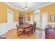 Formal dining room featuring hardwood floors, wainscoting, and large windows at 643 Old Greenville Rd, Fayetteville, GA 30215