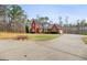 Beautiful brick home with lush landscaping and a long, private driveway at 643 Old Greenville Rd, Fayetteville, GA 30215