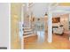 Inviting foyer with hardwood floors, staircase, and a view into the living room at 643 Old Greenville Rd, Fayetteville, GA 30215