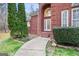 Close-up of the inviting brick entrance and landscaped walkway at 643 Old Greenville Rd, Fayetteville, GA 30215