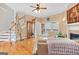 Bright living room with hardwood floors, fireplace, and staircase at 643 Old Greenville Rd, Fayetteville, GA 30215