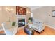 Inviting living room with a fireplace, comfortable seating, and hardwood floors at 643 Old Greenville Rd, Fayetteville, GA 30215